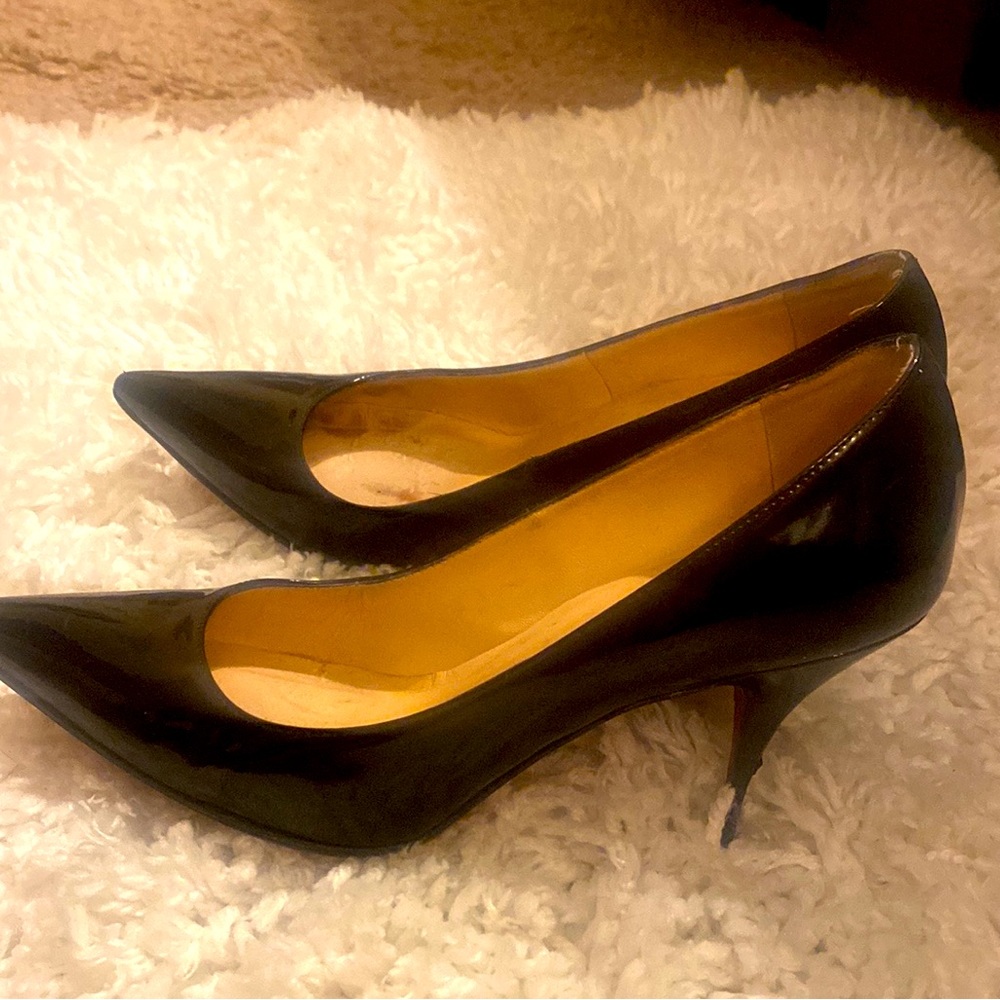 - Christian Louboutin Black Pointed Toe Heels